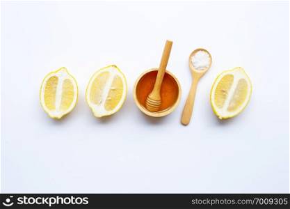 Honey, lemon and  salt on white background