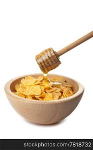 honey pouring over cornflakes isolated