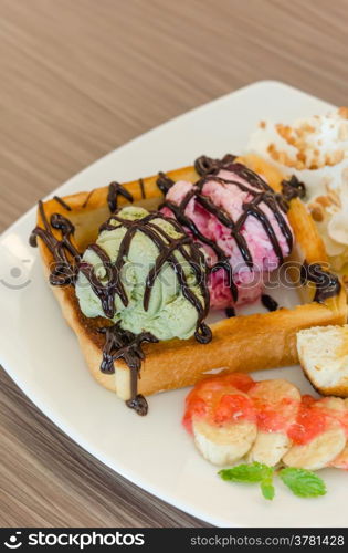 honey toast and ice cream. Honey toast and whipping cream with chocolate sauce and ice cream