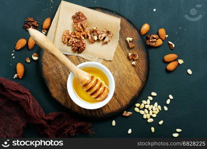 honey with dry almond on a table