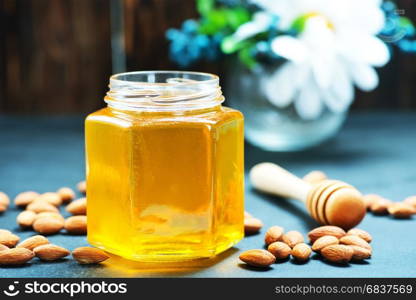 honey with nuts on a table, stock photo