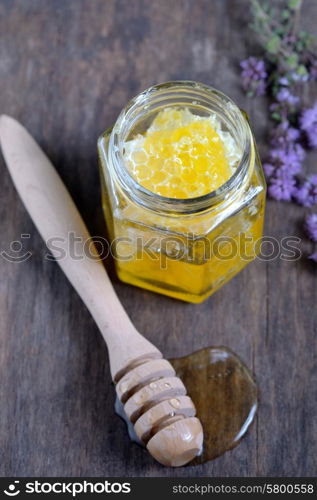 honeycomb and honey in glass jars