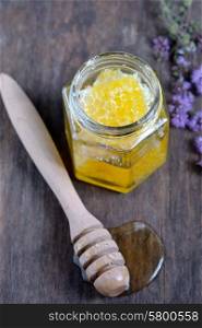 honeycomb and honey in glass jars