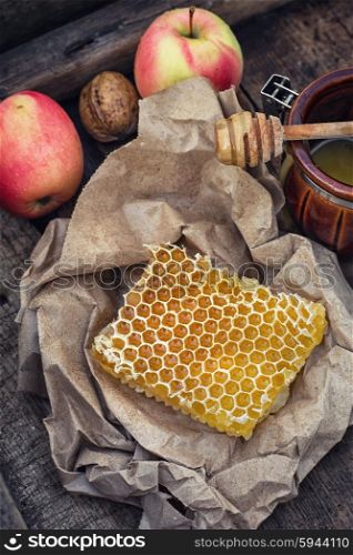 Honeycomb on piece of paper. Still life with honeycombs on crumpled paper in rustic style