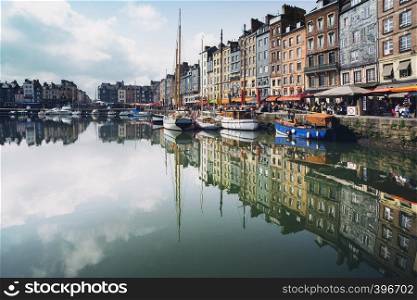 HONFLEUR, FRANCE - APRIL 8, 2018: view of the bay and the embankment in the famous French city Honfleur. Normandy, France