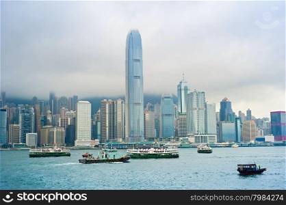 Hong Kong bay with many different ships and rainy clouds