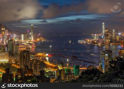 Hong Kong Cityscape skyscraper at twilight time, Hong Kong central and Kowloon island, Victoria peak and harbour, adventure and trekking at red incense burner summit view point for traveler