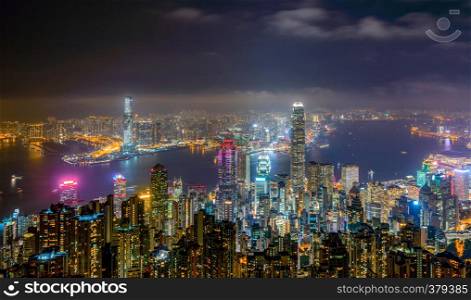 Hong Kong Downtown from Victoria Peak. Financial district and business centers in smart city and technology concept. skyscraper and high-rise office buildings at night.