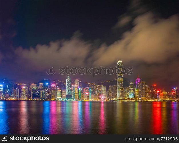 Hong Kong Downtown Skyline and Victoria harbour, Republic of China. Financial district and business centers in technology smart urban city in Asia. Skyscraper and high-rise buildings at night.