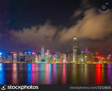 Hong Kong Downtown Skyline and Victoria harbour, Republic of China. Financial district and business centers in technology smart urban city in Asia. Skyscraper and high-rise buildings at night.