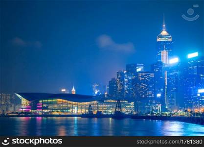 Hong Kong. Embankment, skyscrapers and exhibition center. Cloudy night. Hong Kong Night Quay and Exhibition Center