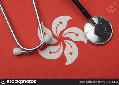 Hong Kong flag and stethoscope. The concept of medicine. Stethoscope on the flag as a background.. Hong Kong flag and stethoscope. The concept of medicine.