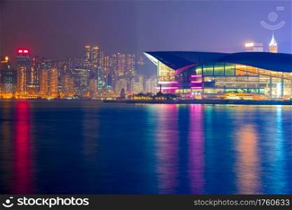 Hong Kong. Night view of the island embankment and Convention and Exhibition Center with night lights. Night Embankment of Hong Kong and Convention and Exhibition Centre