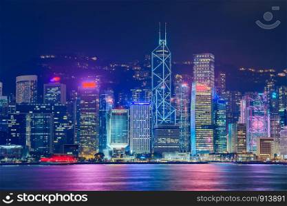 Hong Kong skyline cityscape downtown skyscrapers over Victoria Harbour in the evening. Hong Kong, China