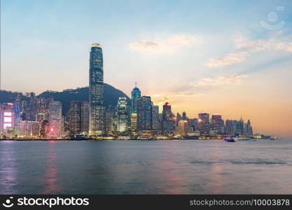 Hong Kong skyline on the evening seen from Kowloon, Hong Kong, China.. Hong Kong skyline on the evening seen from Kowloon.