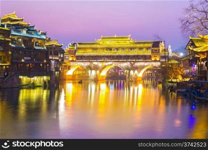 Hongqiao Bridge at Fenghuang (Phoenix) ancient town sunset duak, Hunan province, China