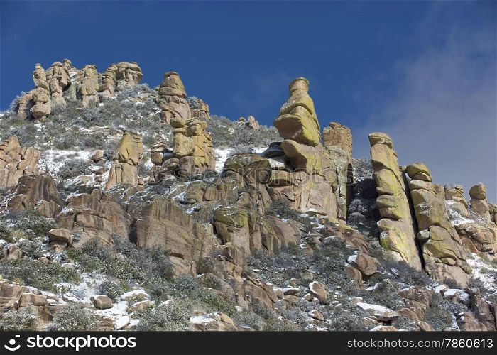 Hoodoo rock formations on Mt. Lemmon Scenic Byway are touched with snow. Location is Tucson, Arizona, USA.