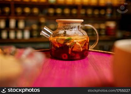 Hookah bar counter, tonic drink in glass teapot, nobody. Shisha smoking equipment, traditional smoke culture, tobacco aroma for relaxation. Hookah bar, tonic drink in glass teapot, nobody