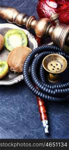 hookah shisha with kiwi. smoking hookah in Arabic style with the tobacco aroma kiwi