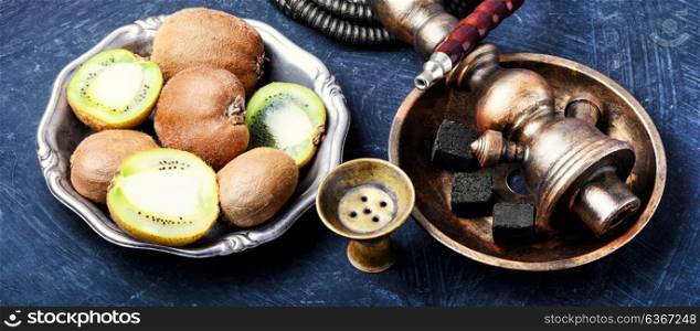 hookah shisha with kiwi. smoking hookah in Arabic style with the tobacco aroma kiwi