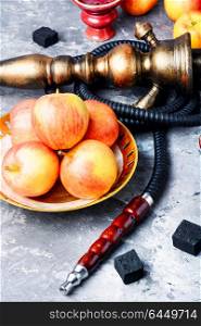 hookah with apple for relax. Smoke hookah with apple.Shisha concept.Hookah concept.Fruit hookah