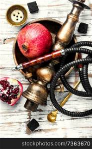 Hookah with fruit aroma for relax.Shisha hookah.Hookah with pomegranate.Pomegranate tobacco. Hookah with pomegranate flavor
