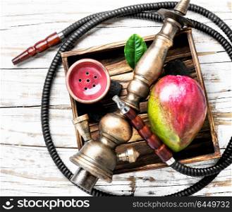 hookah with mango for relax. Smoke hookah with with mango.Shisha concept.Hookah concept