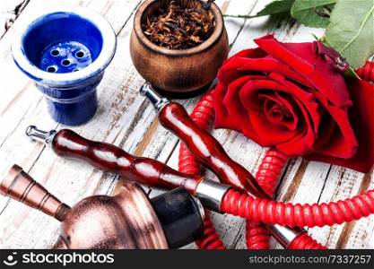 Hookah with rose aroma for relax.Shisha hookah.Hookah with flower.Flower smoking tobacco. Flower with hookah