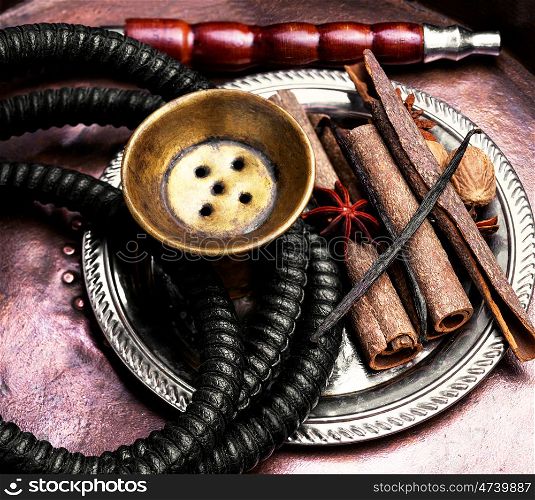 Hookah with spices. egyptian smoking shisha in east style with tobacco aroma of spices.