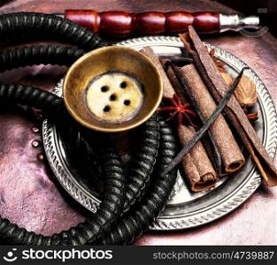 Hookah with spices. egyptian smoking shisha in east style with tobacco aroma of spices.