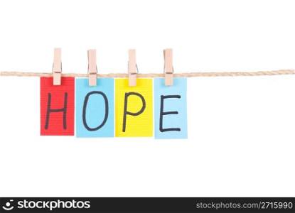 Hope, Colorful words hang on rope by wooden peg