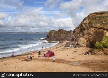 Hope Cove, Devon, UK ? August 16, 2013: Holiday makers enjoying the summer sun on the popular beach at Hope Cove.