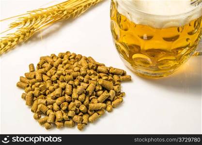 Hops pellets with beer glass