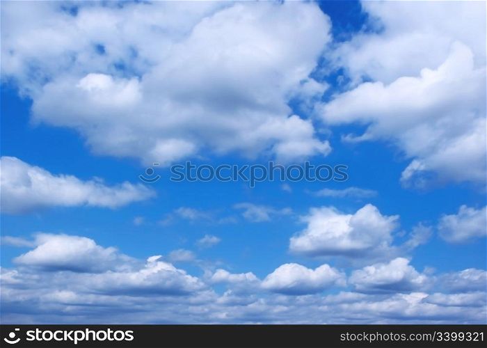 horizon of several rain clouds on a blue sky before a storm