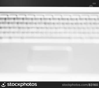 Horizontal black and white laptop keyboard bokeh background. Horizontal black and white laptop keyboard bokeh background