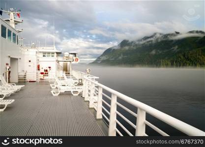 Horizontal composition passenger ferry glides along inland waterway