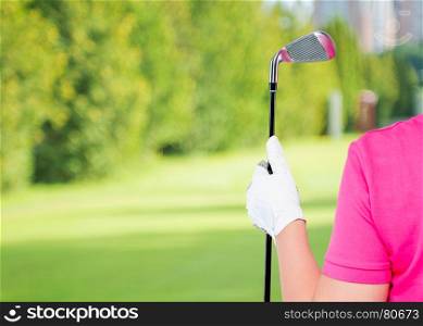 horizontal Photo gloved hand with a golf club and a space on the left