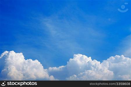 Horizontal photo of white clouds in the blue sky