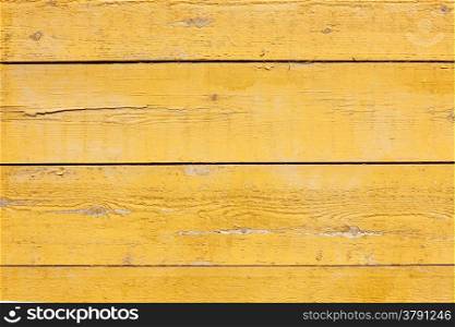horizontal picture of old horizontal planks with bright yellow paint