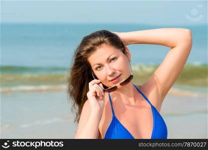 Horizontal portrait of a beautiful girl on the beach