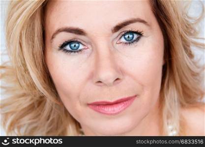 Horizontal portrait of adult blond woman with makeup