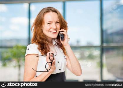 Horizontal portrait of an office worker with a phone consultant