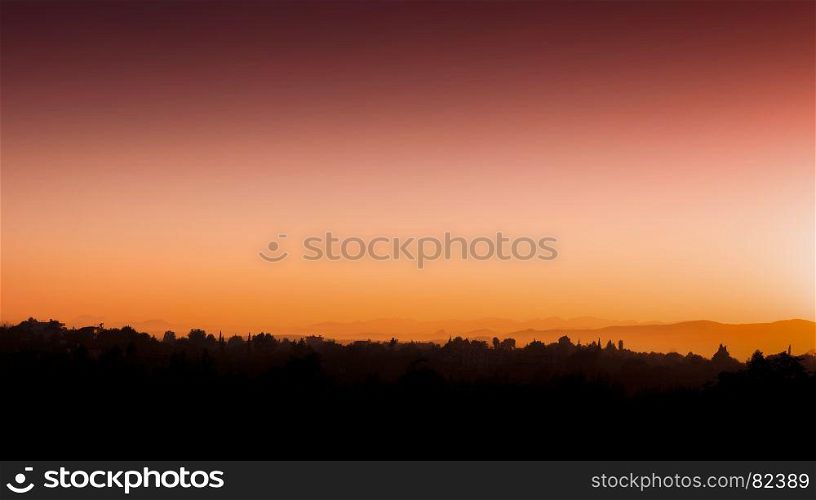 Horizontal red orange vivid Turkish sunset horizon silhouette background backdrop. Horizontal red orange vivid Turkish sunset horizon silhouette ba