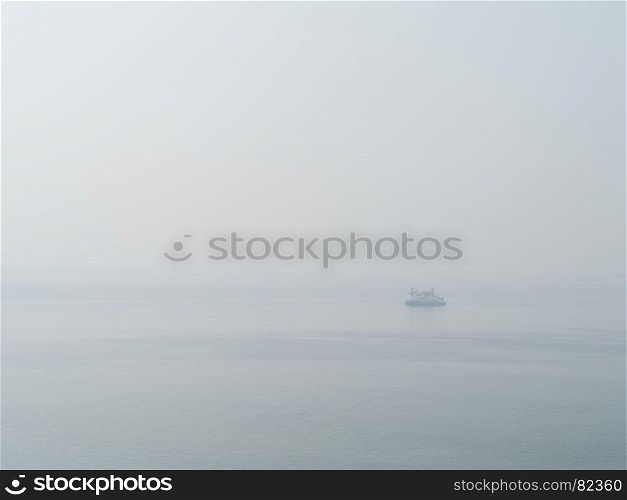 Horizontal sparse pale lonely ship in white ocean background backdrop. Horizontal sparse pale lonely ship in white ocean background bac