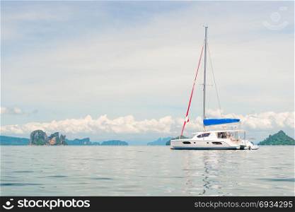 horizontal toned photo - white yacht in the bay of the Andaman Sea, Thailand