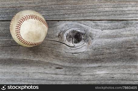 Horizontal top view angle of old baseball on rustic wood