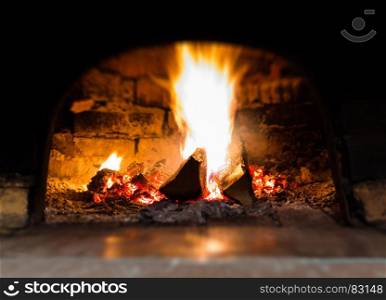 Horizontal vibrant fire in stove bokeh background backdrop