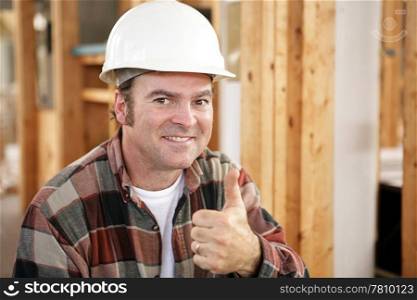 Horizontal view of a construction worker giving a thumbs up. Authentic construction worker on actual construction site. Room for text.