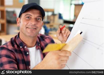 horizontal view of focused carpenter at work