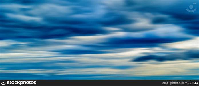 HORIZONTAL VIVID BLUE CLOUDSCAPE DRAMATIC CLOUDS ABSTRACTION BACKGROUND BACKDROP. HORIZONTAL VIVID BLUE CLOUDSCAPE DRAMATIC CLOUDS ABSTRACTION BAC